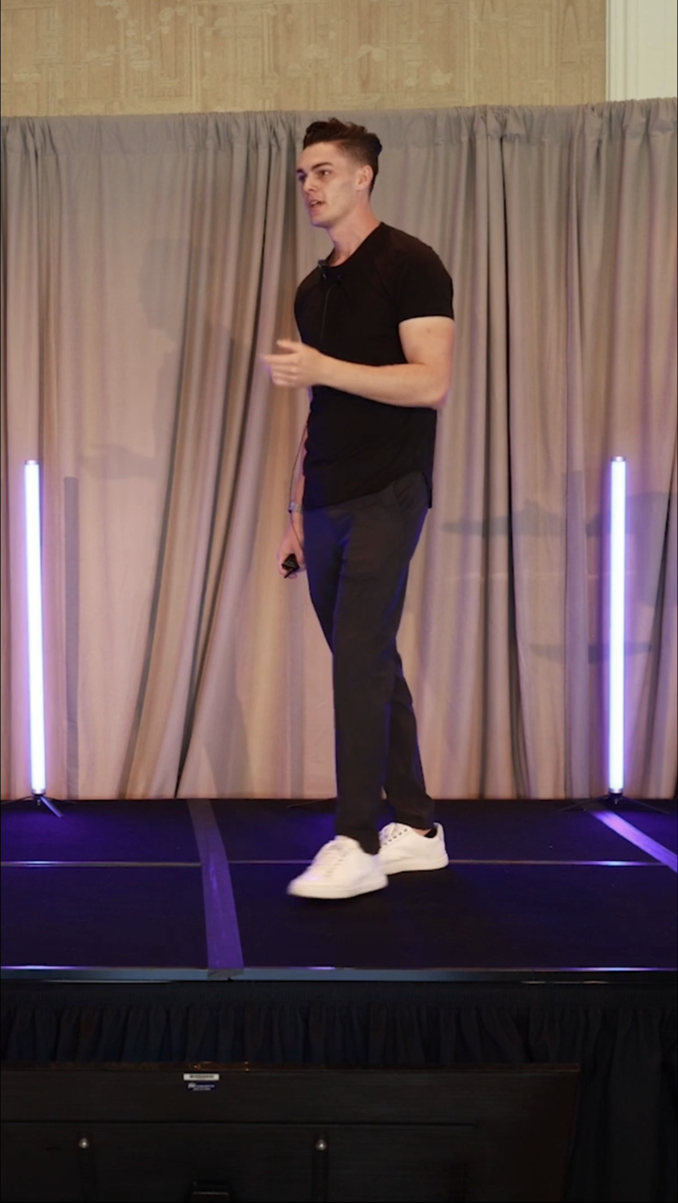 Peyson Robertson speaking on stage